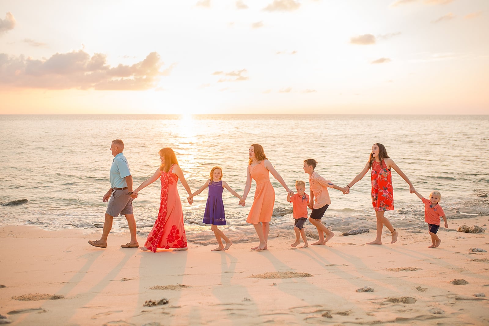 Large family of 8 on the beach at sunset in Yomitan, Okinawa Japan by Alison Bell Photographer