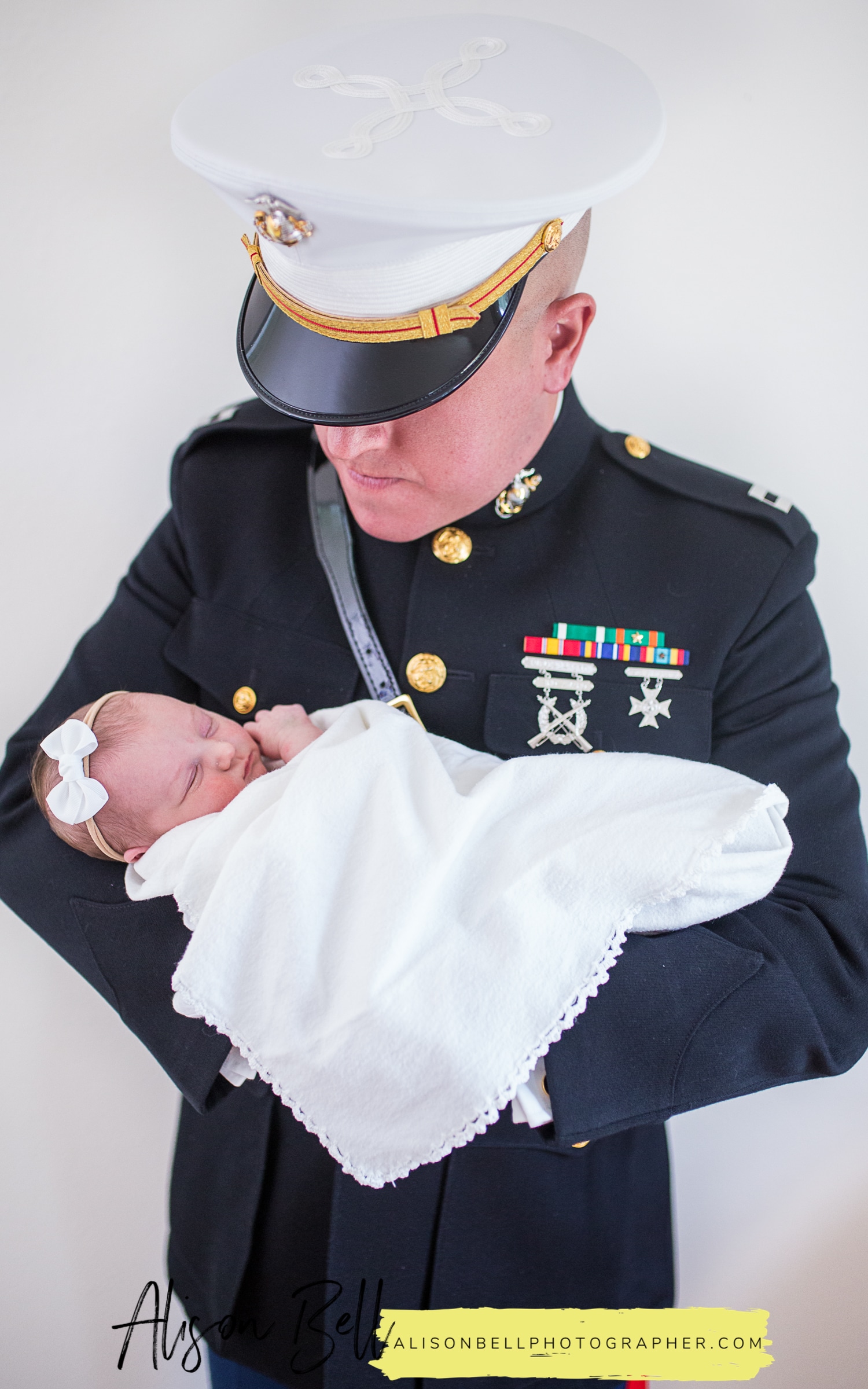 Lifestyle newborn photography in home with USMC dress blues. Officer Blues by Alison Bell, Photographer alisonbellphotographer.com