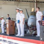 Navy change of command ceremony in a hangar at Naval Air Station Oceana in Virginia Beach, VA