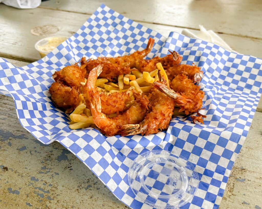 Plate of fried shrimp and fries from a Kauai family eat shrimp station in Kauaʻi, Hawaii. Family photos by Alison Bell, photographer in Hawaii.